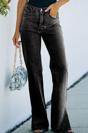 Flared hem denim trousers in dark wash with a slit detail.