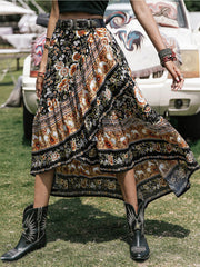 Bohemian floral asymmetric midi skirt with a multicolor print and ruffled hem.