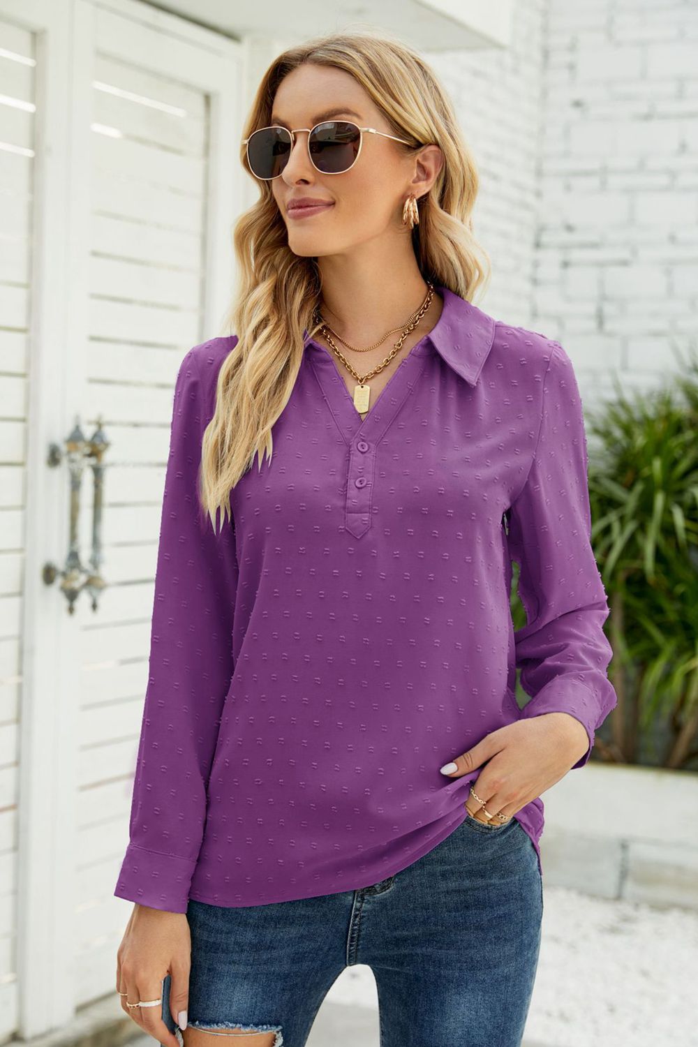 Purple textured collared blouse with button placket and long sleeves.