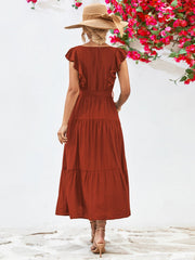 Flutter sleeve tiered midi dress in brick red with belt and ruffle details.