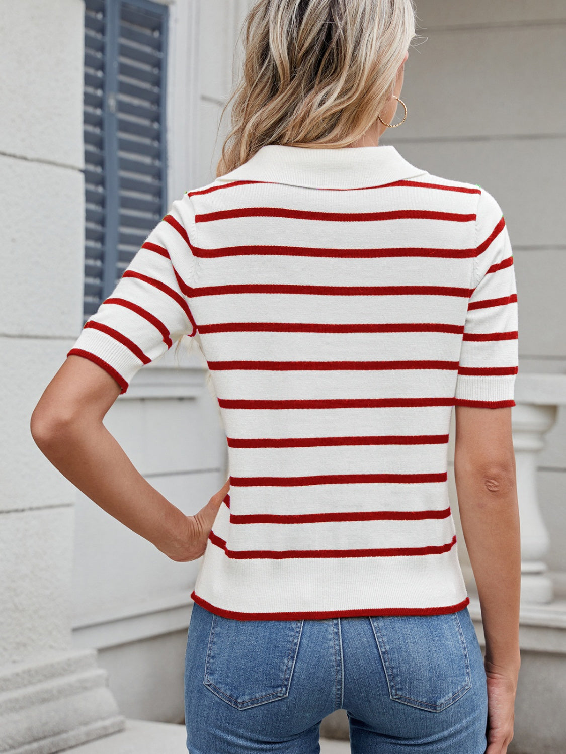 Nautical stripe polo knit top in deep red and white with short sleeves and a collar.
