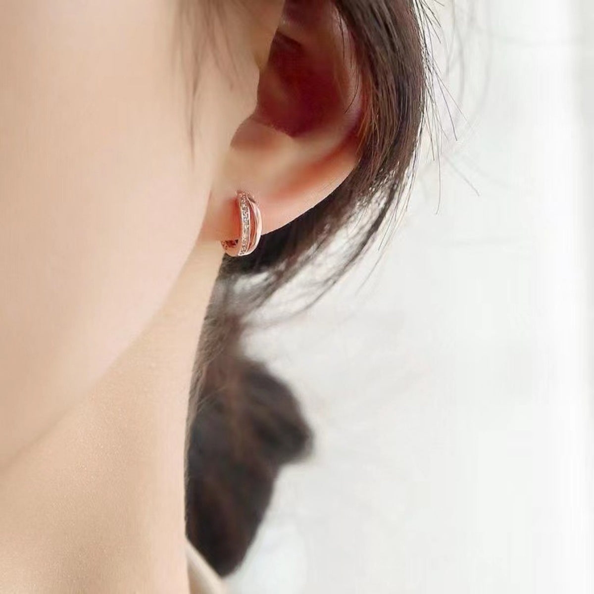 Delicate rose gold hoop earrings with small crystals, 18k gold plated 925 silver.