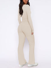 Beige loungewear set with long sleeve top and flared pants.