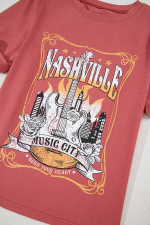 Burnt coral graphic tee with Nashville Music City guitar and city skyline print.