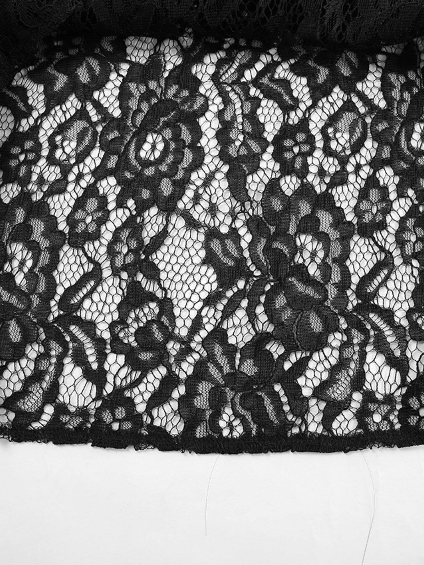 Black lace maxi skirt with intricate floral pattern and sheer detail