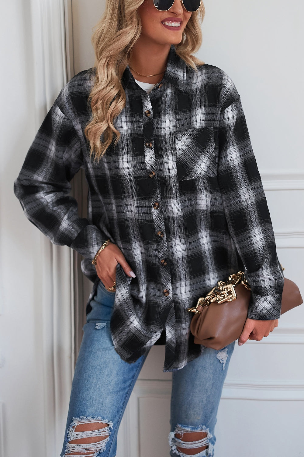 Plaid drop-shoulder jacket in black and white with button front and chest pocket.