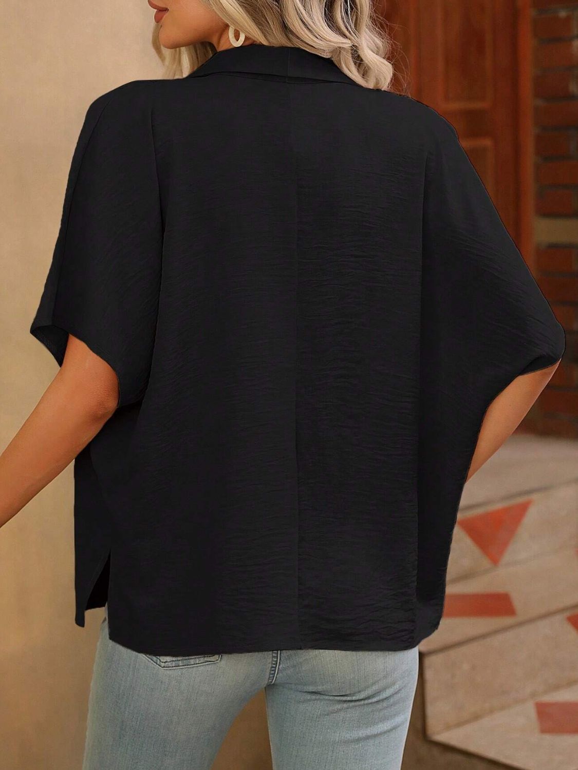 Black silk-effect collared blouse with short sleeves and textured fabric.