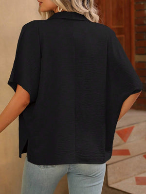 Black silk-effect collared blouse with short sleeves and textured fabric.