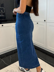 Button-front denim midi skirt in medium wash, with a slit and a fitted silhouette.
