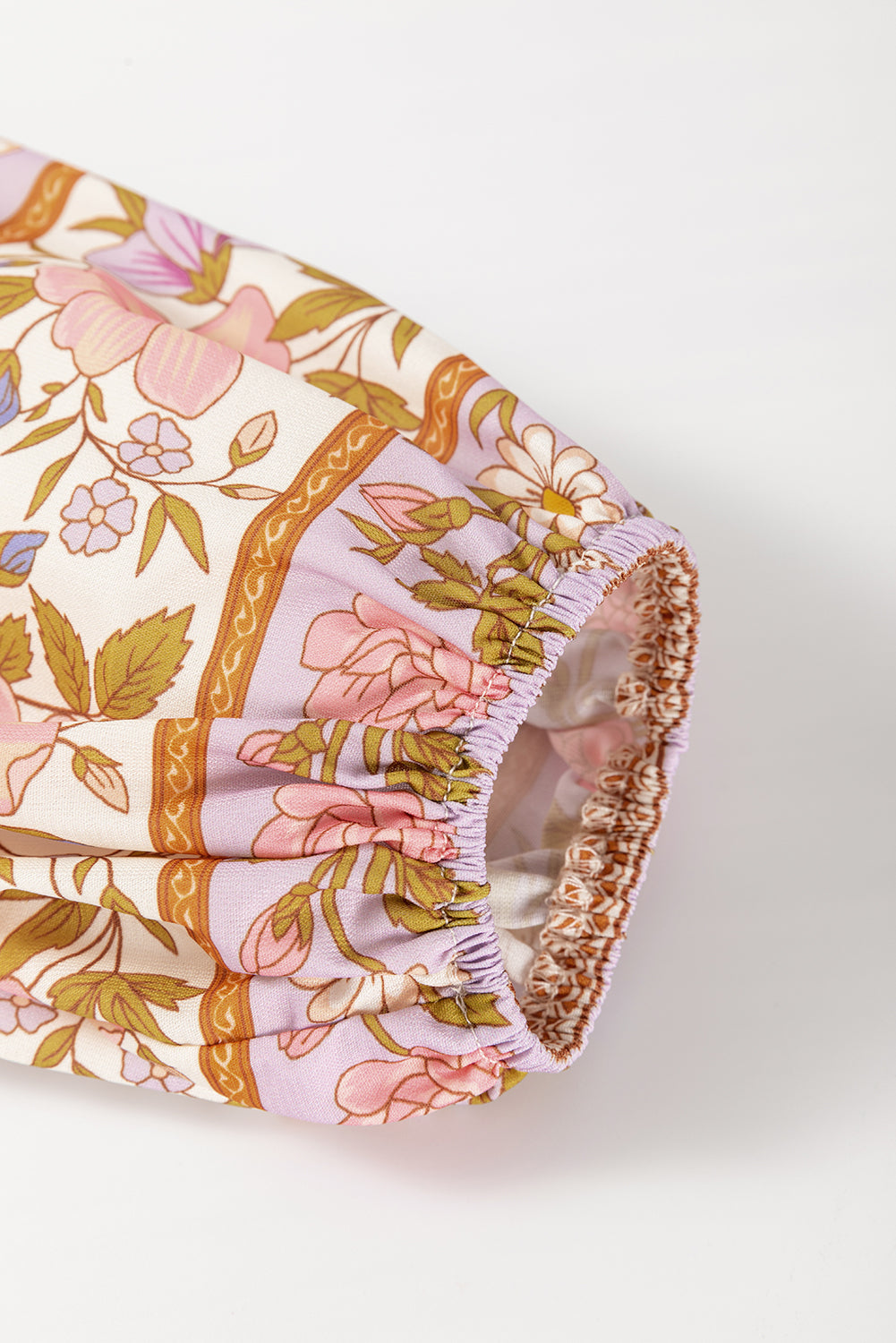 Bohemian print blouson sleeve top with floral pattern and elasticized cuff
