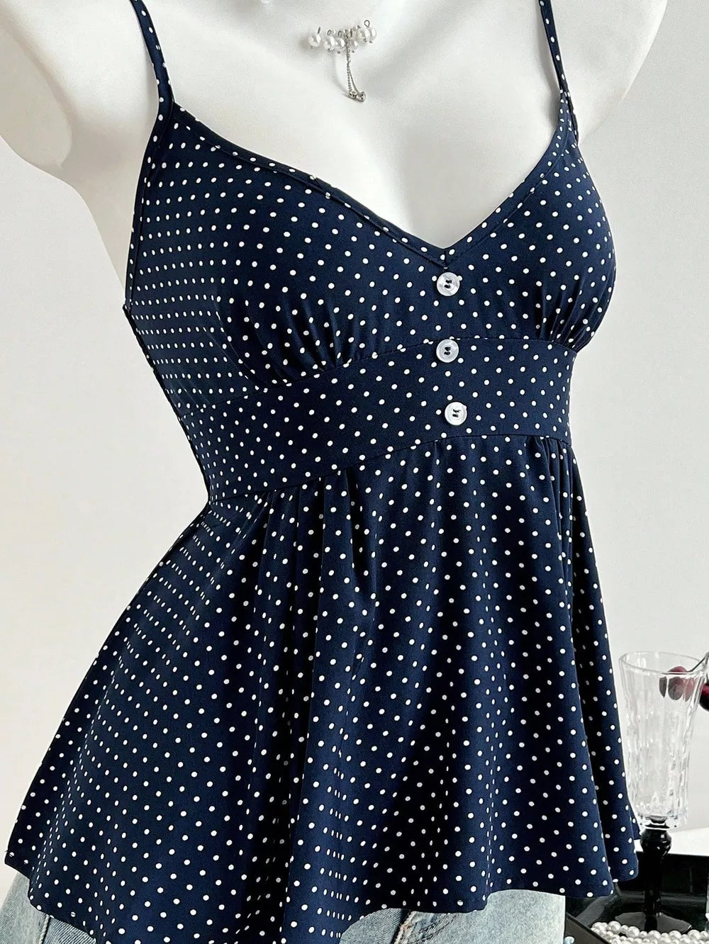 Polka Dot Peplum Cami in Navy, model styling view