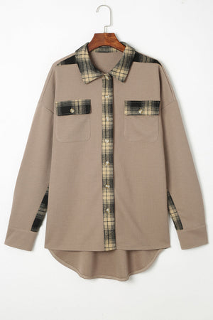Tan waffle knit overshirt with plaid trim on collar, placket, and chest pockets.