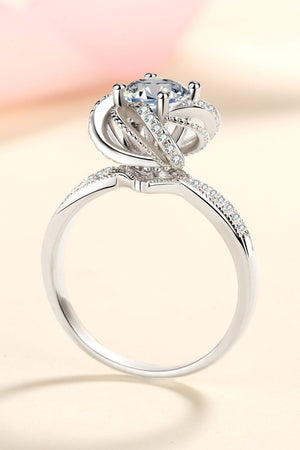 Silver halo ring with moissanite and pavé details.