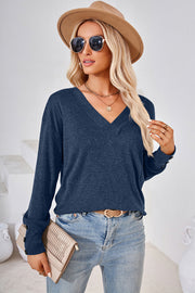 Dusty Blue V-neck top with button cuffs and a slouchy fit.