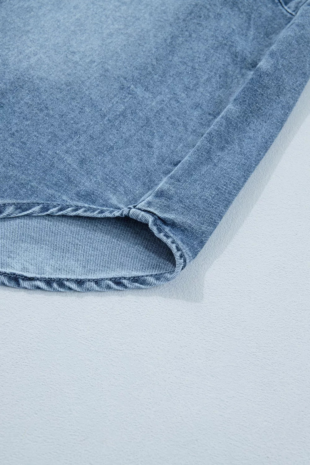 Light wash denim shirt with frayed hem detail