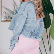 Light wash denim trucker jacket with fringe and star detail