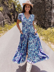 Floral V-neck midi dress with buttons, shirred waist, and a high slit.