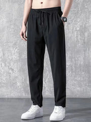 Black relaxed-fit drawstring trousers with elastic waistband and side pockets.