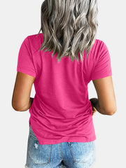 Hot pink raglan pocket t-shirt with short sleeves and a relaxed fit.