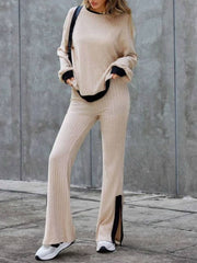 Tan ribbed knit lounge set with black trim and slit hem pants.