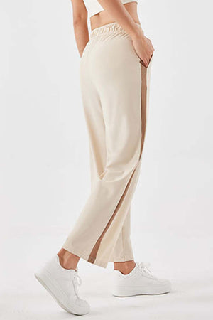 Side stripe relaxed trousers in camel with a side slit detail and elastic waistband.