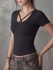 Black crossover V-neck t-shirt with glitter detail and short sleeves.