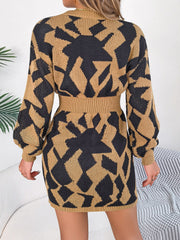 Knit mini dress in khaki with black geometric pattern, long sleeves, and belted waist.