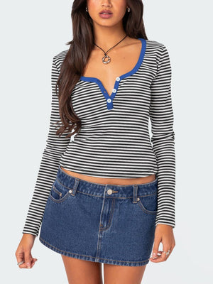 Striped long sleeve henley shirt with contrast royal blue collar and button placket.