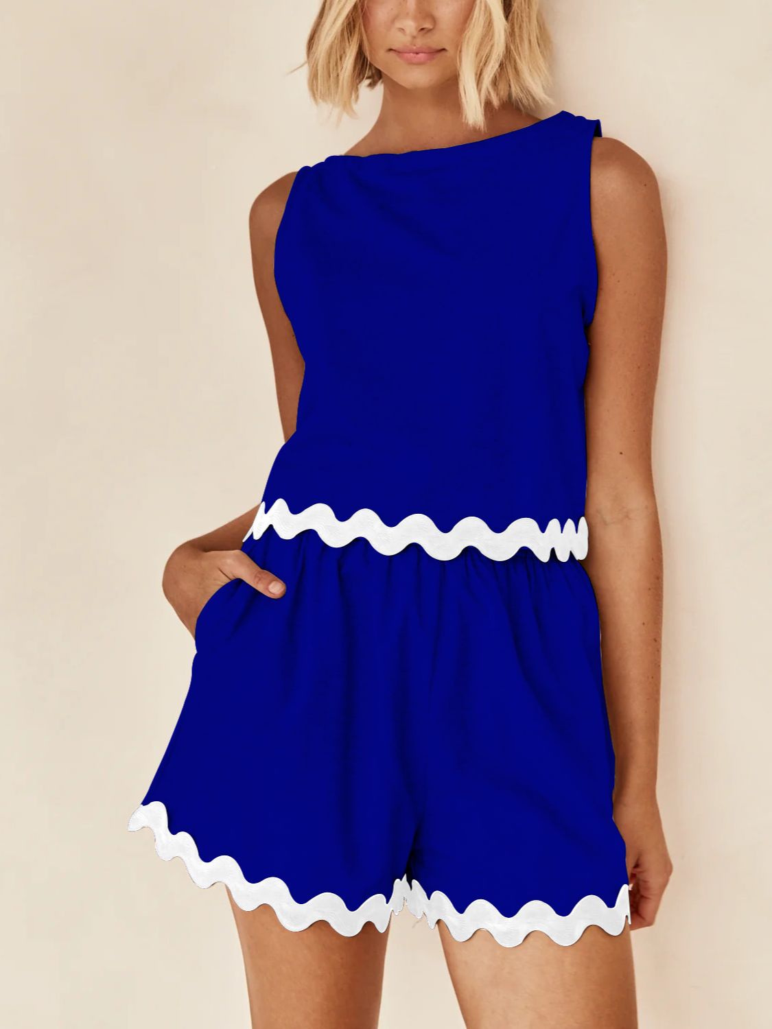 Royal blue scalloped edge tank and shorts set with white trim detail.