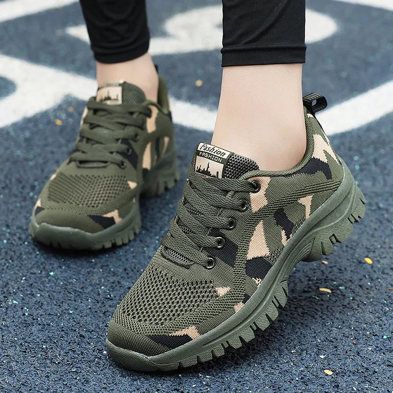 Camouflage mesh performance trainers in moss green with lace-up closure and athletic sole.