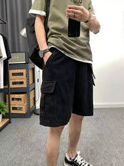Men's black cotton cargo shorts with multiple pockets.