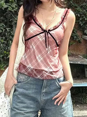 Plaid ruffle trim tank top with black ribbon tie and velvet trim.