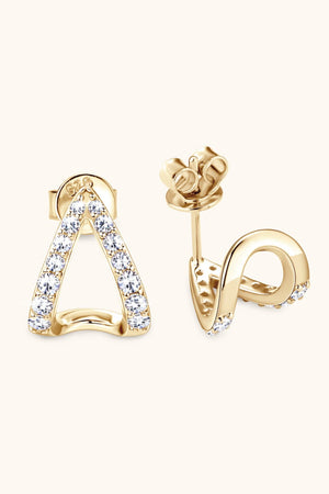 Gold geometric moissanite open-hoop earrings with pavé-set stones.