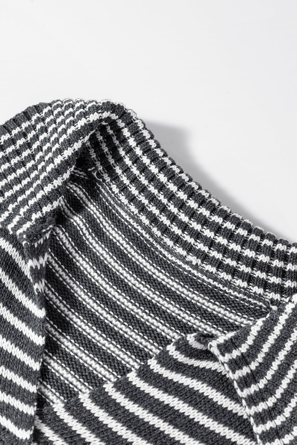 Gray striped knit polo vest with a mock neck and acrylic material.