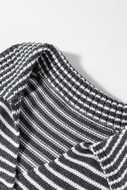 Gray striped knit polo vest with a mock neck and acrylic material.