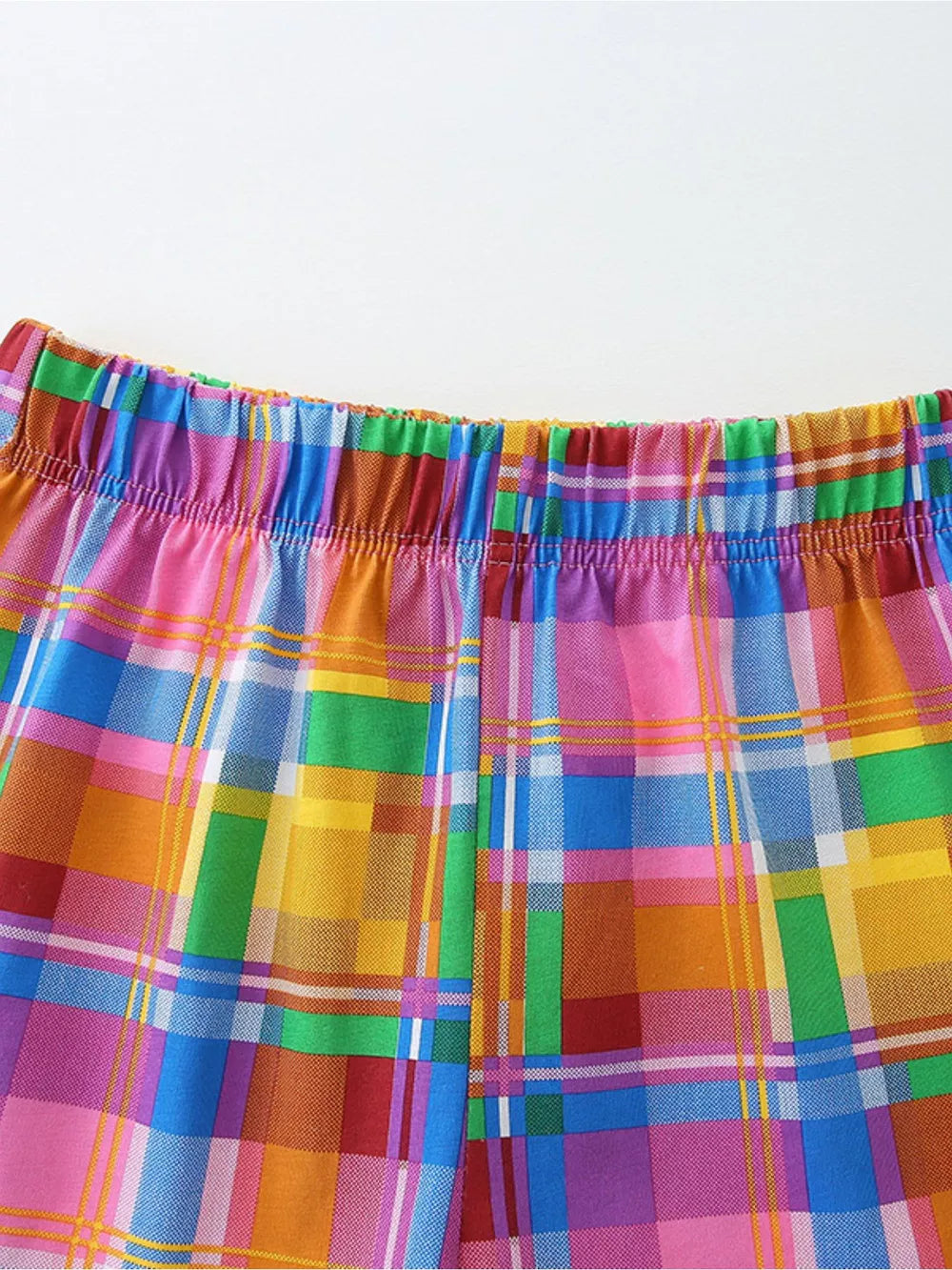 Toddler rainbow plaid cotton blend shorts with elastic waistband.