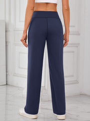 Dark navy wide-leg lounge trousers with a high waist and straight leg, shown from the back.