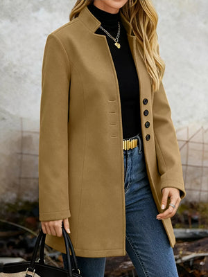 Khaki longline trench coat with button-down detail and collarless neckline.