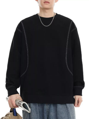 Black oversized long-sleeve sweatshirt with contrast stitching and crew neck.
