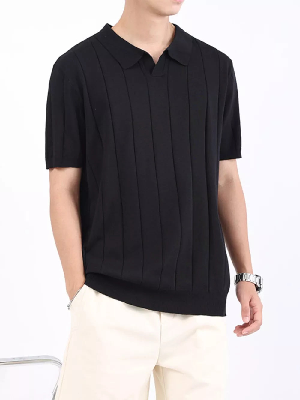 Black ribbed knit polo shirt with vertical seams and short sleeves.