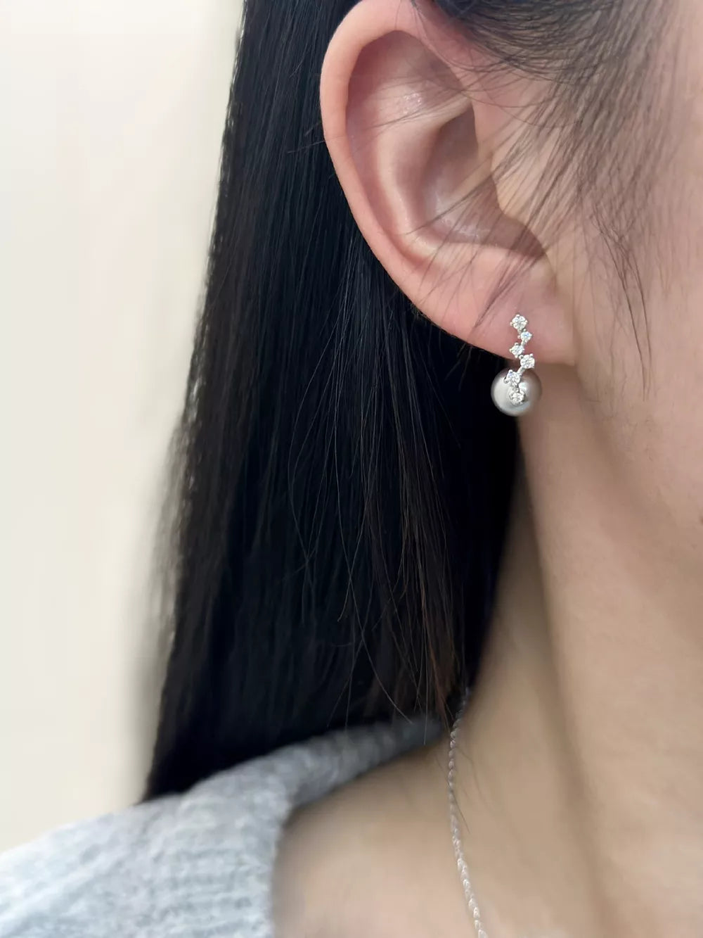 Elegant gray pearl drop earrings with cubic zirconia accents in sterling silver.