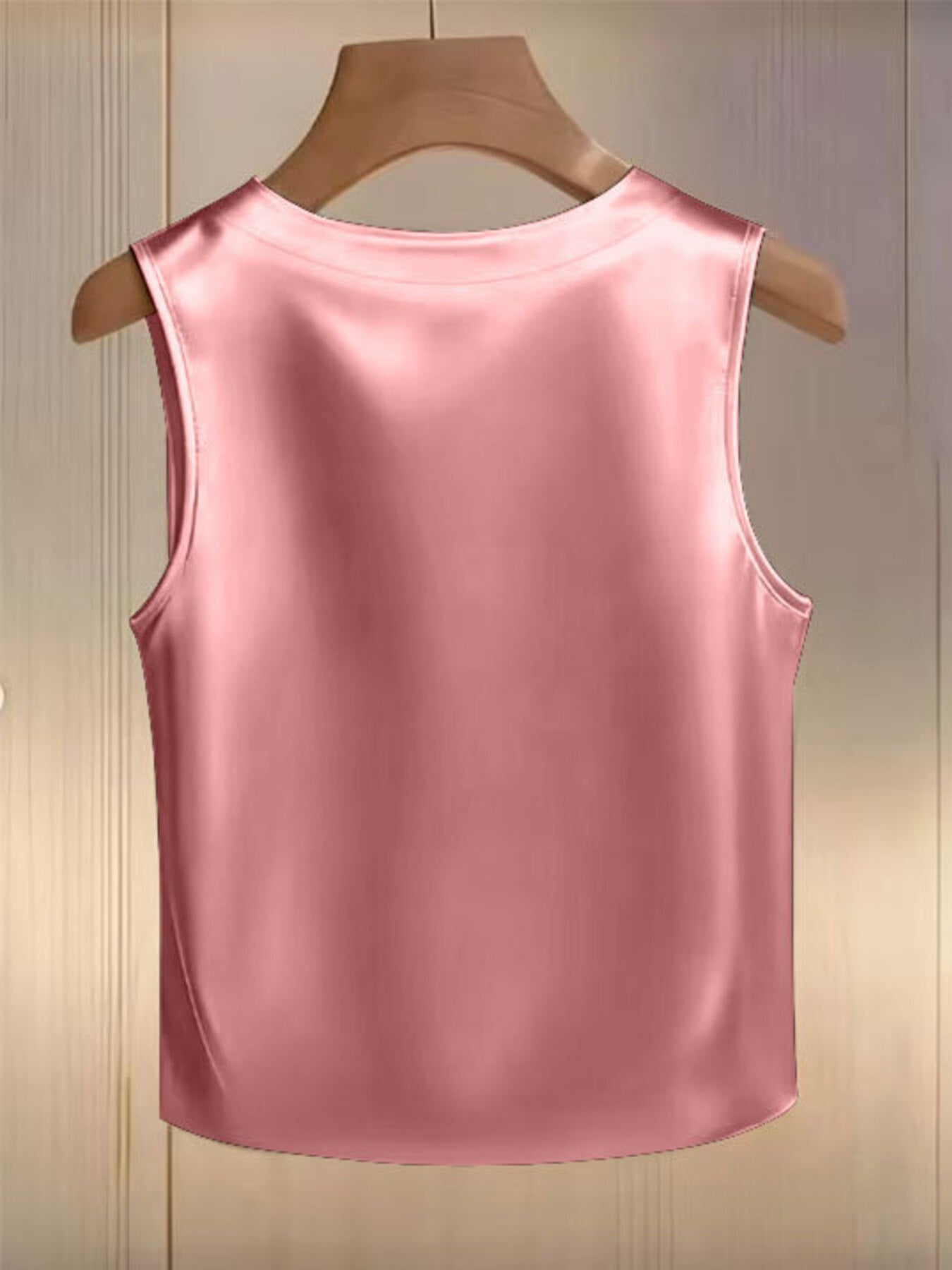 Pink satin tank top with pearl embellishments, crew neck, sleeveless.