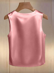 Pink satin tank top with pearl embellishments, crew neck, sleeveless.