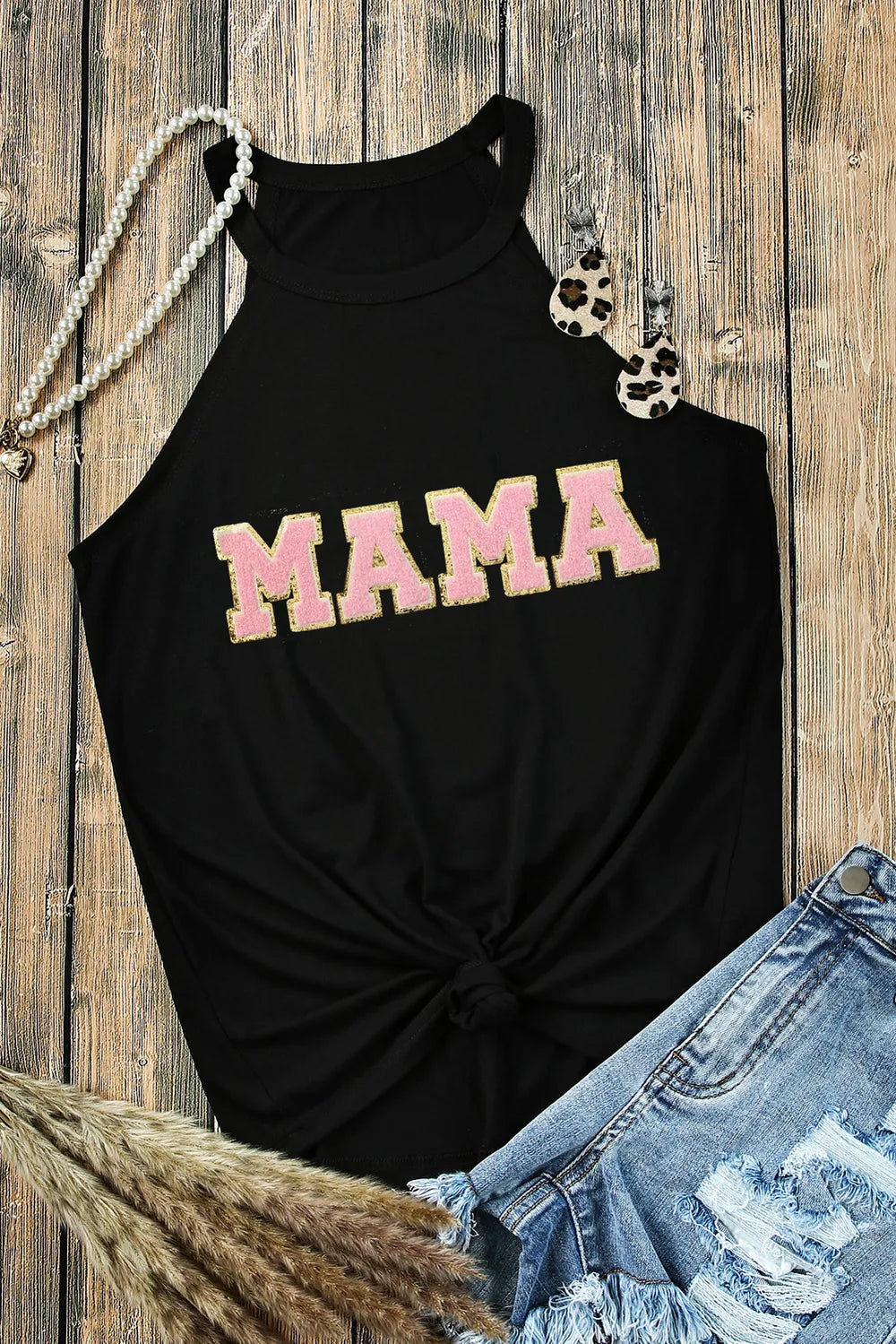 Black halter tank top with pink "MAMA" graphic and knot detail