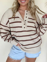 Beige striped knit henley sweater with button detail and contrast stitching.
