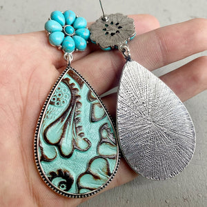 Tooled leather teardrop earrings with turquoise flower detail in Sky Blue and Brown.