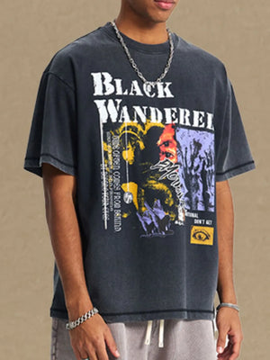 Black Wanderer graphic tee with washed cotton texture and abstract art print.