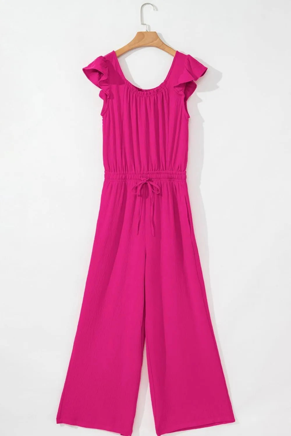 Hot pink textured jumpsuit with ruffle sleeves and drawstring waist