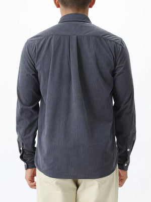 Gray corduroy long sleeve buttoned shirt with back pleats and buttoned cuffs.