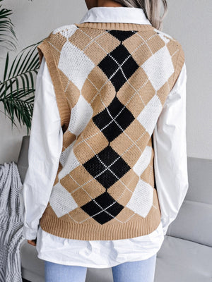 Argyle knit sweater vest in tan, black, and white acrylic, styled over a white shirt.
